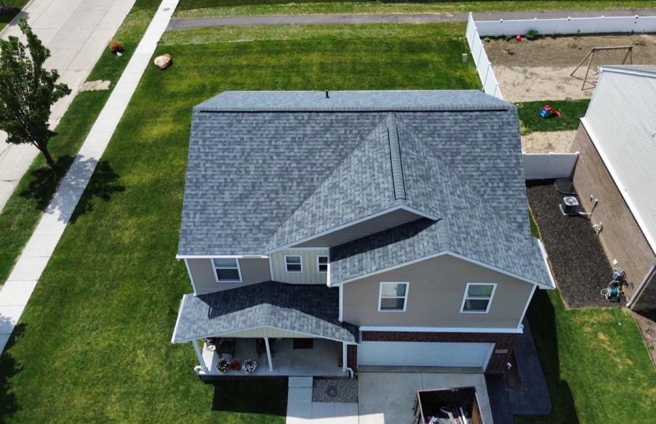 Two-story metro Detroit home with clean siding and a new architectural shingle roof